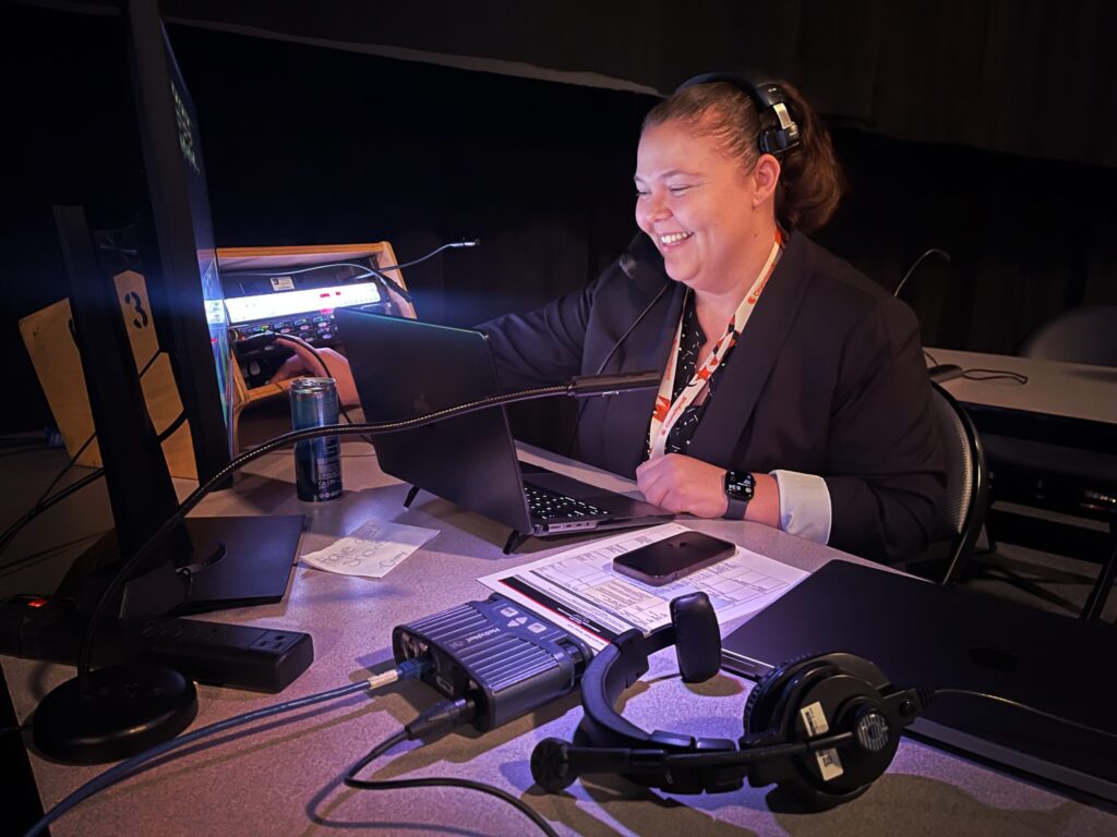 Shawna Voragen calling a live event from the production desk.